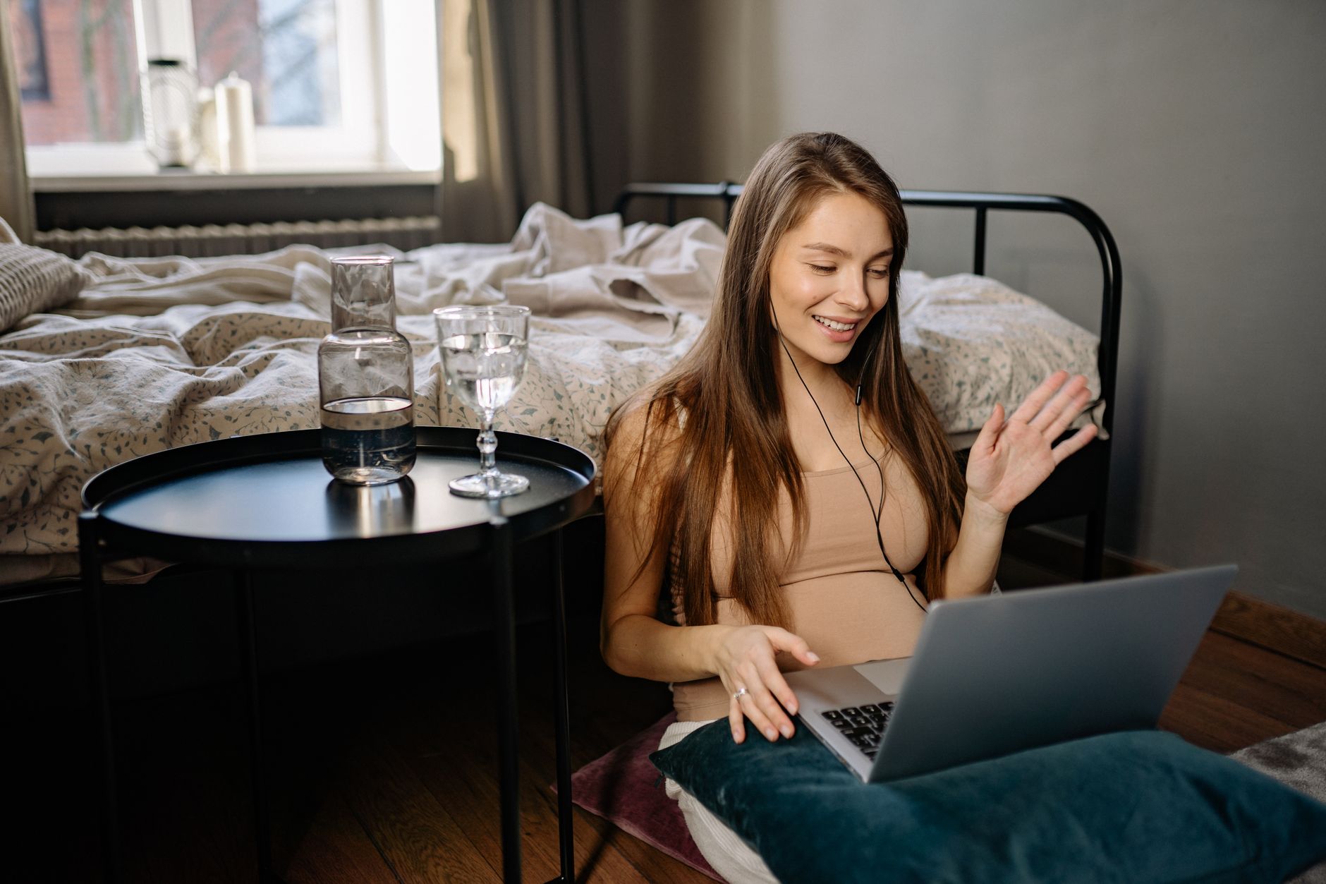 Patient connecting to an evening telehealth visit from home