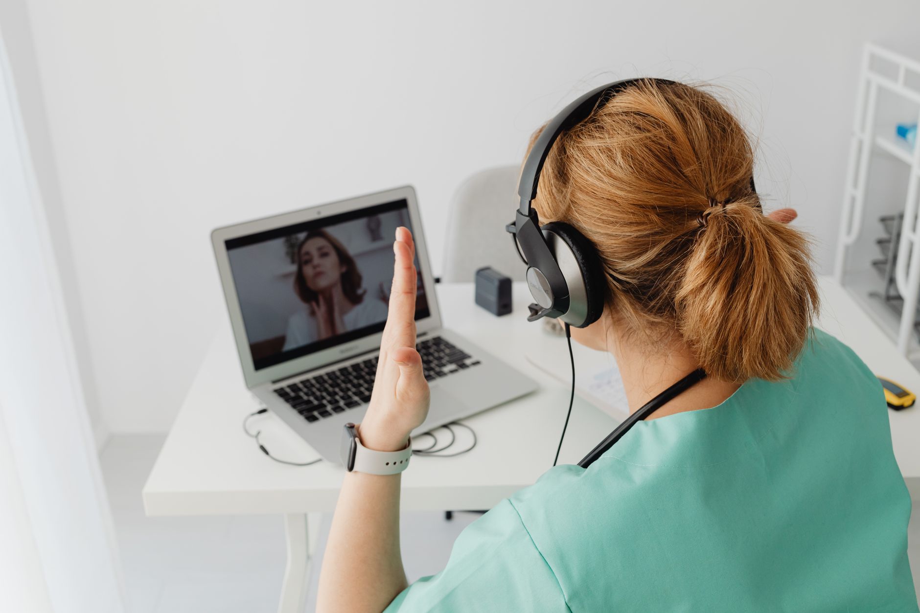 Nurse practitioner speaking with a patient during an evening telehealth video visit