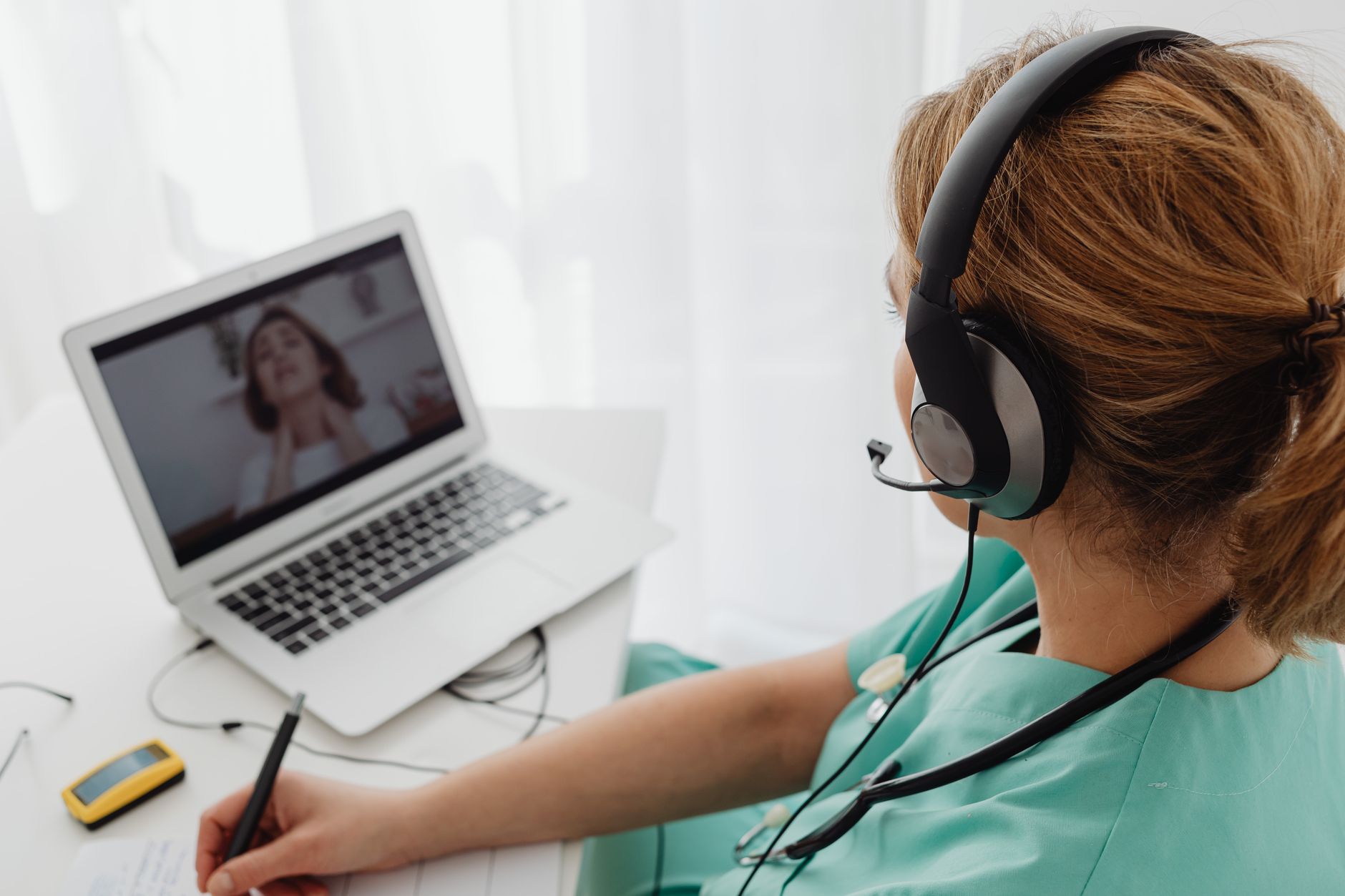 Clinician greeting a patient at the start of a telehealth video visit
